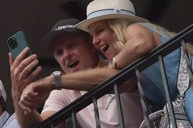 Justin Rose and his wife on the phone