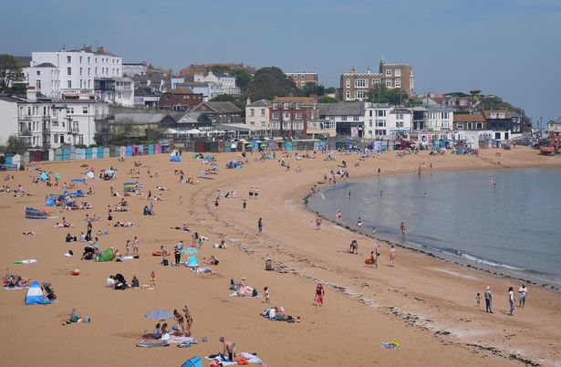 People enjoy the beach in Broadstairs, Kent