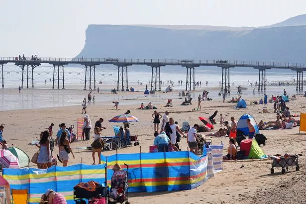 People on the beach at Saltburn-by-the-Sea in North Yorkshire.