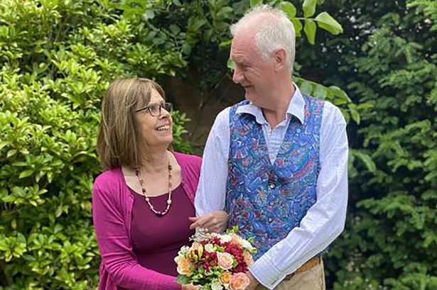 Two people holding flowers
