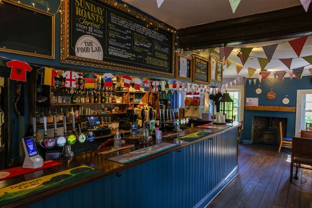 Inside The Farm pub in St Werburghs you'll find a fireplace, plenty of favourites at the bar, and beautiful farm-esque bunting and decor