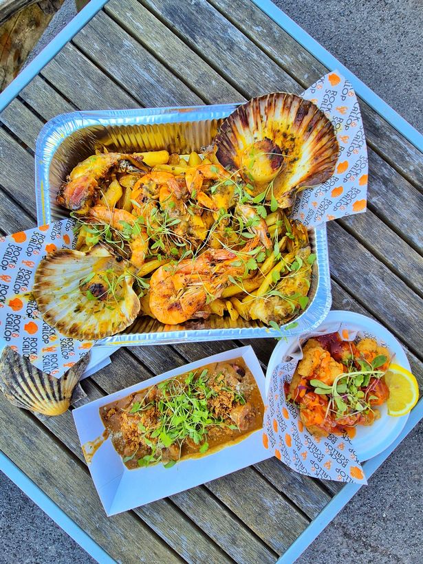The Seafood Mixed Grill is a massive feast of lobster prawns and half-shell scallops drenched in their signature "secret" garlic butter and served with crispy Parmesan-dusted chips.