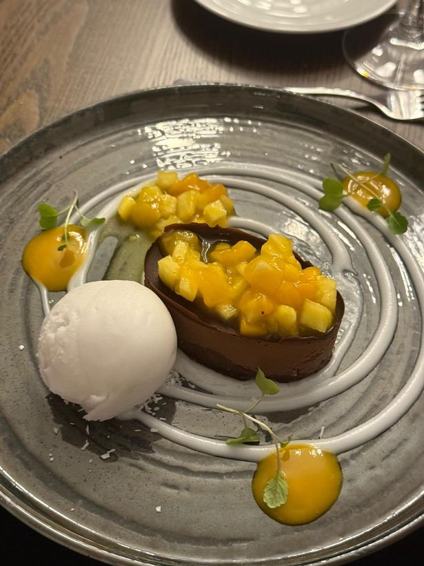 Chocolate cake and sorbet on a plate