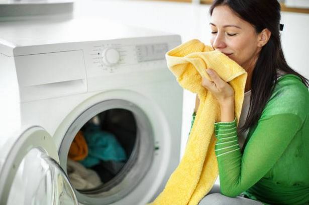 Lady smelling her fresh laundry