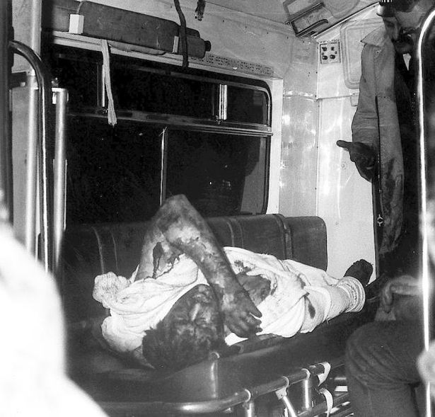 Jim Doyle murder victim lying in the back of an ambulance.