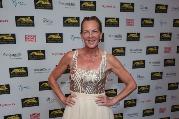 Lorraine stanley in long white dress