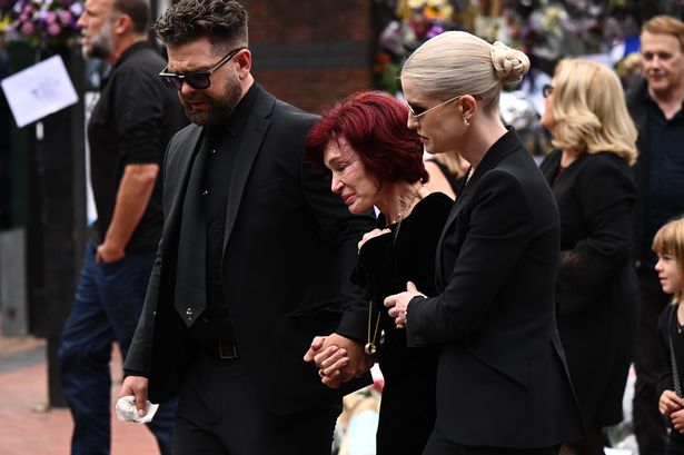 Jack Osbourne, Sharon Osbourne and Kelly Osbourne arrive to view tributes to the late Ozzy Osbourne from fans as his funeral cortege travels through his home city of Birmingham 