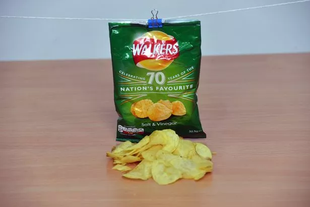 A packet of Walkers Salt and Vinegar crisps