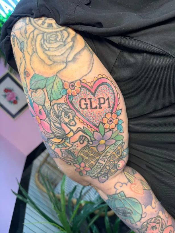 Woman with tattooed arm