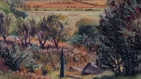 CJ & AB Rea/Nan Youngman Estate A painting by Nan Youngman of Llanfrothen in Wales. It is slightly up a hillside with dark green trees on the right, a black obelisk in the foreground, beyond it are shrubs and trees and falling away from that are fields in shades of soft green and pink. 