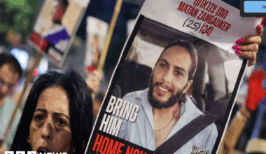 Enav Zangauker holds a portrait of her kidnapped son, Matan, during an anti-government protest calling for action to secure the release of Israeli hostages held captive in Gaza.