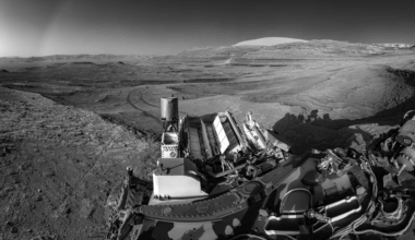 This view of tracks trailing behind NASA’s Curiosity was captured while the rover simultaneously relayed data to a Mars orbiter.