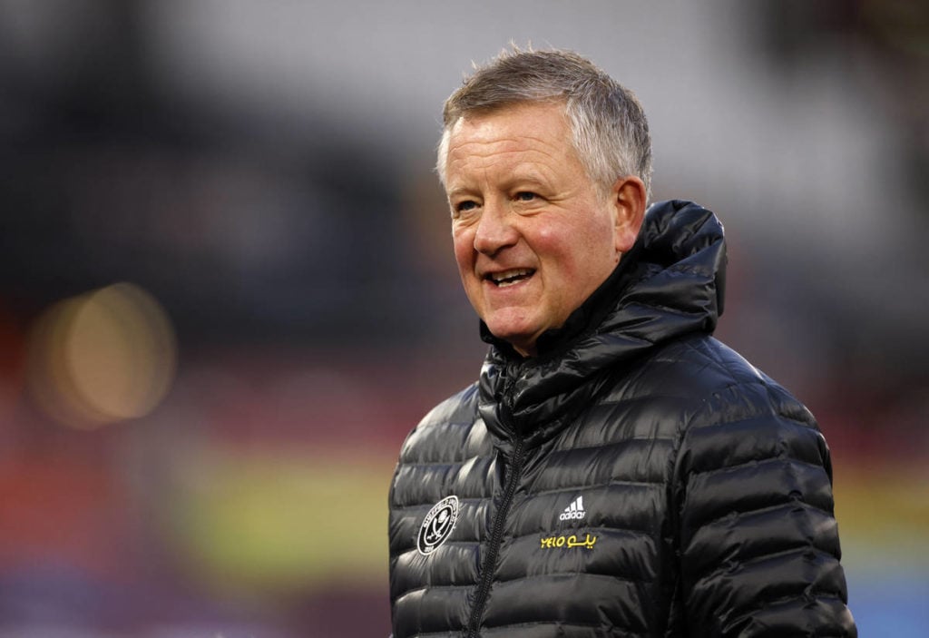 Sheffield United manager Chris Wilder in black wet coat