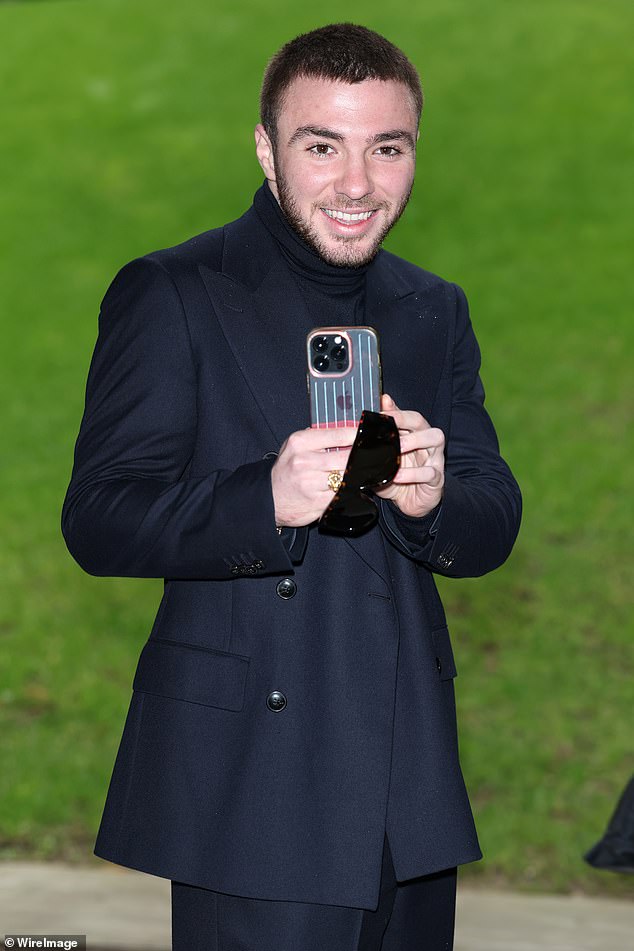 Queen of Pop Madonna and director Guy Ritchie's 24-year-old son, Rocco, comes third wearing a simple black tailored suit