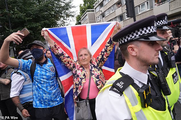 Anti-immigration protesters outside the Thistle City Barbican Hotel in central London