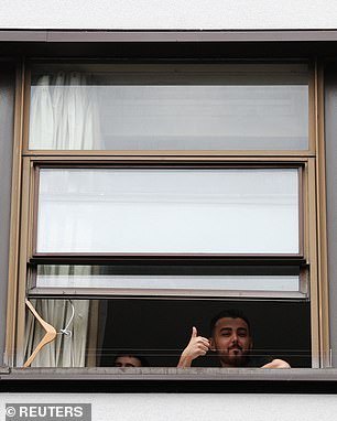 One man could  be seen giving a thumbs up to those below