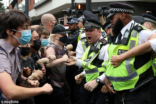 Police clash with counter protesters on the streets of Islington as protests against housing migrants in a local hotel continues