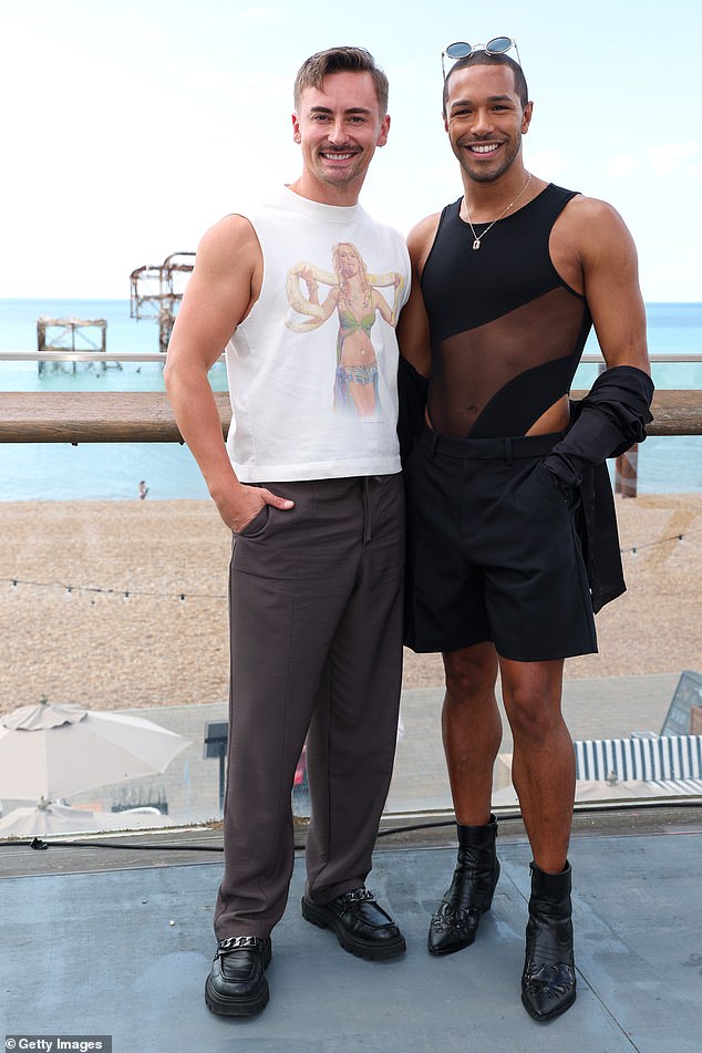 Drag royalty Ella Vaday, 36, channelled pop nostalgia in a sleeveless white Britney Spears tee, while Michael Gunning, 31, turned heads in a sleek black bodysuit featuring an asymmetric mesh panel