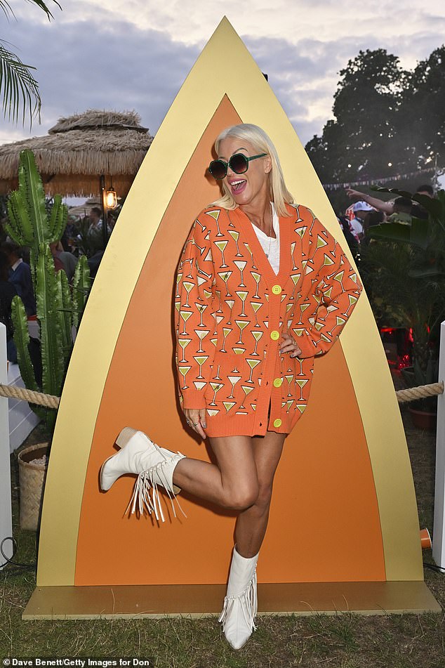 Presenter Denise, 51, put on a leggy display in a quirky orange cardigan which featured a martini art design