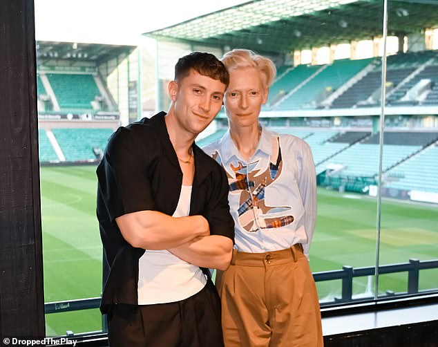 Tilda showed off their quirky sense of style for the outing, opting for a pair of cropped brown trousers, which they paired with a £600 Charles Jeffrey Loverboy patchwork detail shirt