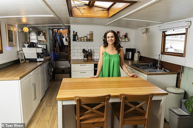 She took out a loan to buy a dark green and white houseboat which cost over £100,000, and she moved into the accommodation in May 2024 with her ex-partner in the Bristol Marina. Pictured on her houseboat