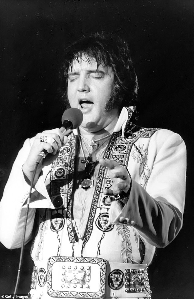 Pictured: Elvis Presley in concert in 1977, the same year he died