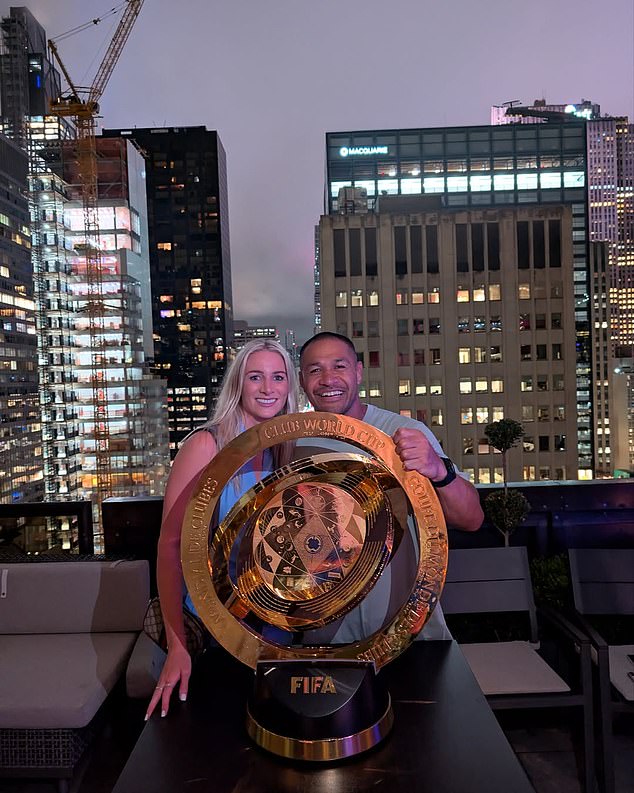 Isa celebrates the Club World Cup win with his partner Gemma Bonner, who is a defender for Liverpool, the club he grew up supporting