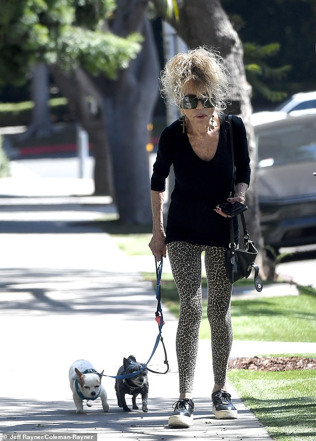 This iconic glamor girl from the '60s and '70s was spotted looking as fashionable as ever while taking her adorable pooches for a walk in Los Angeles last week