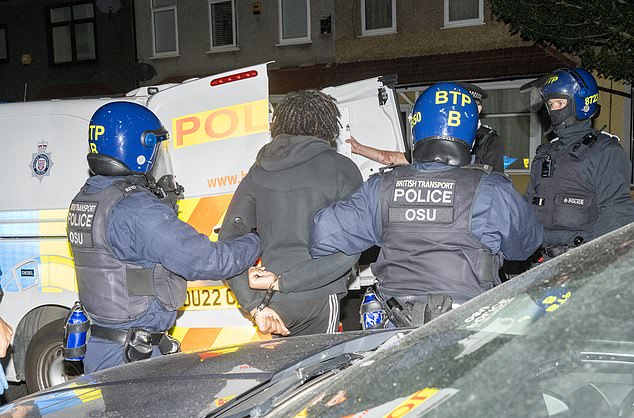 In one raid in Newham, officers in riot gear rushed inside, arrested the suspect, and placed him in handcuffs