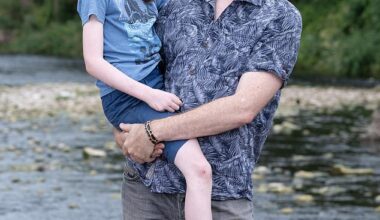Kim Hilton with his son Lochryn. Kim says he is much more cautious about swimming in rivers after getting sick from wild swimming
