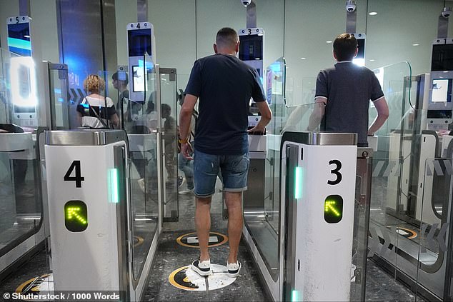 Strict new border regulations mean Brits travelling to Europe will soon need to prove they have medical insurance and a return ticket, The Times reports. Pictured: Air travellers pass through automated passport border control e-gates at Heathrow Airport on August 2, 2024