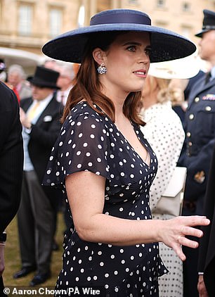 At the Buckingham Palace Garden Party earlier this year, Eugenie was photographed in a navy short-sleeve dress with white polka dots by Rixo