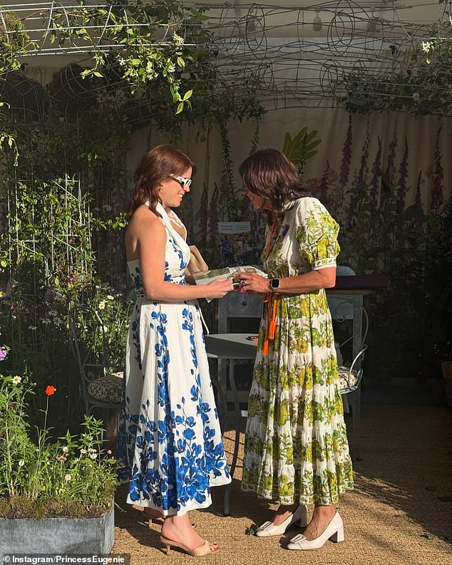 Eugenie took a leaf out of Meghan's style book and wore a blue and white orchid midi dress by Rebecca Vallance at the opening day of the Chelsea Flower Show