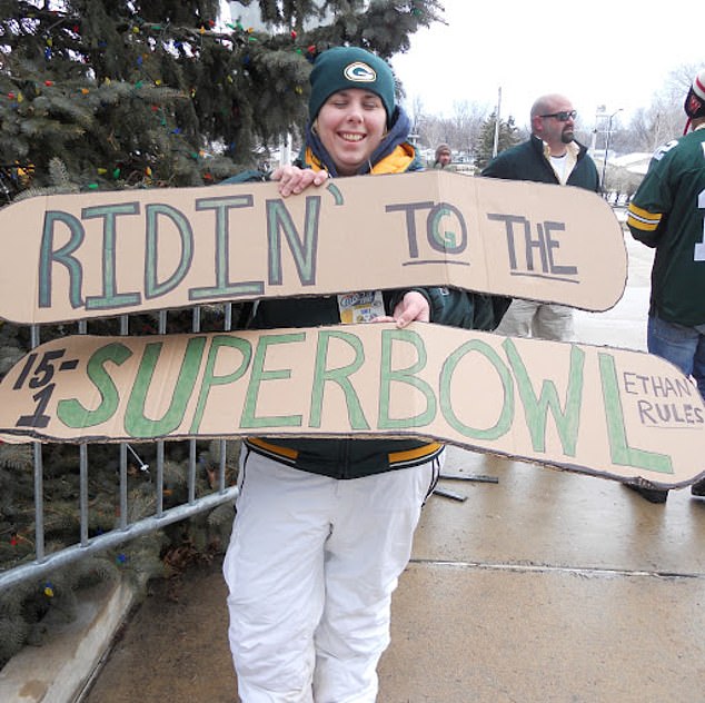 Fan: Aimee Betro holds a sign supporting American football¿s Green Bay Packers