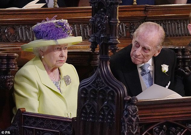Queen Elizabeth II and Prince Philip during the wedding service for Harry and Meghan at St George's Chapel, Windsor