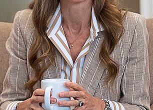 During a recent visit to the RHS Wellbeing Garden at Colchester Hospital, Kate wore a Ralph Lauren Collection striped shirt in white and camel tones