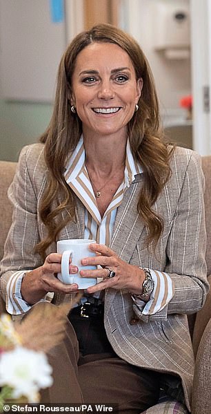During a recent visit to the RHS Wellbeing Garden at Colchester Hospital, Kate wore a Ralph Lauren Collection striped shirt in white and camel tones