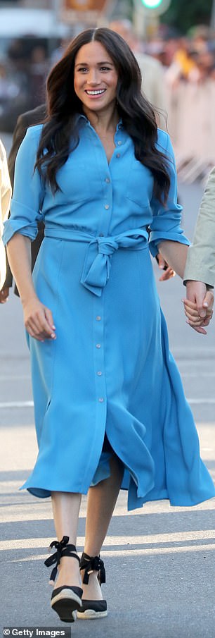 Meghan opts for the black version, featuring the same canvas fabric, ankle ties and 3-inch jute wedge heel