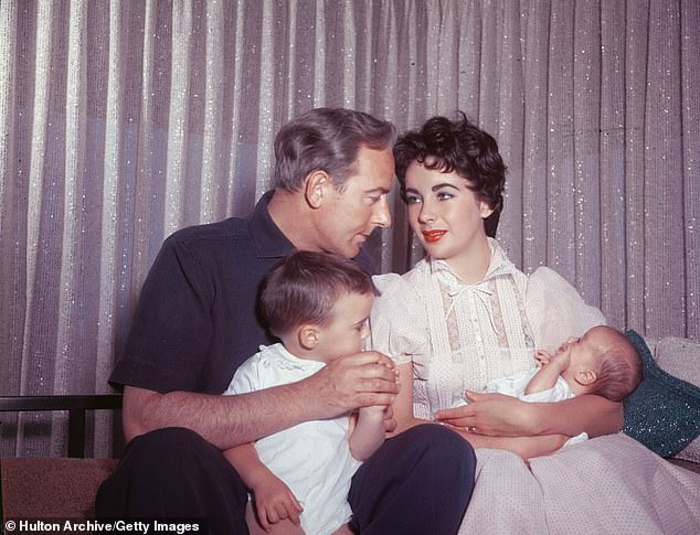 Taylor welcomed Christopher and her 72-year-old son Michael (2-L, pictured in 1955) during her four-year marriage to her Conspirator co-star turned second ex-husband Michael Wilding (L), which ended in 1957