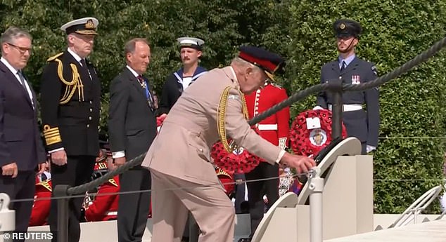The King was seen laying a wreath, before the two-minute silence at 12pm