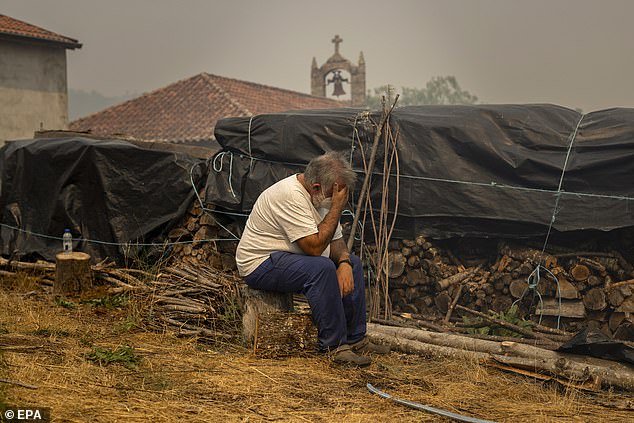 A resident in distress during a wildfire in Cualedro