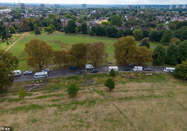 A large group of caravans have moved onto the road going through Ealing Common in West London