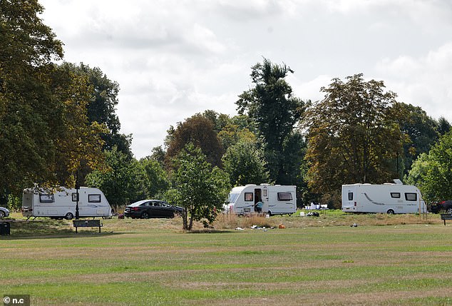 A large group of caravans have moved onto the road going through Ealing Common