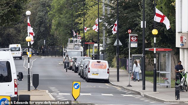 England flags flying along a road in Tower Hamlets this morning