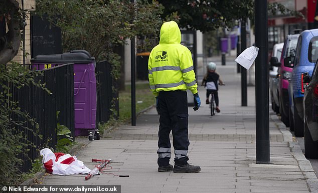 One of the England flags on the pavement after being taken down this morning