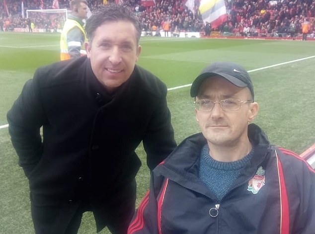 Mogan pictured with Liverpool legend Robbie Fowler. If found guilty of racism, the fan will be banned by Liverpool for life
