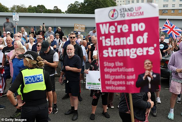 Hundreds of people turned out to protest outside an asylum hotel in Falkirk, with counter-protesters also staging a rally