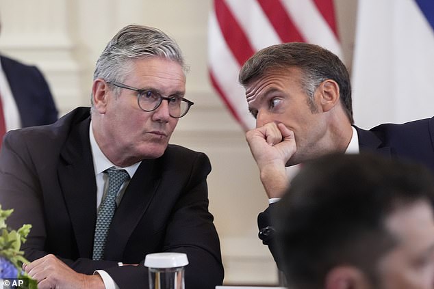 UK prime minister Keir Starmer and French president Emmanuel Macron appeared to be engaged in a side conversation during Monday's press conference