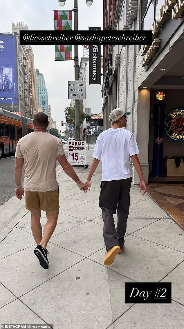 An image showed the father and son walking side-by-side and holding hands in Downtown LA