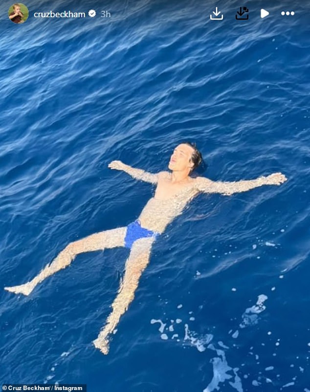 Meanwhile, after previously causing a stir in a pair of white Prada swim shorts, Cruz switched them for a purple pair as he posted a picture floating in the sea